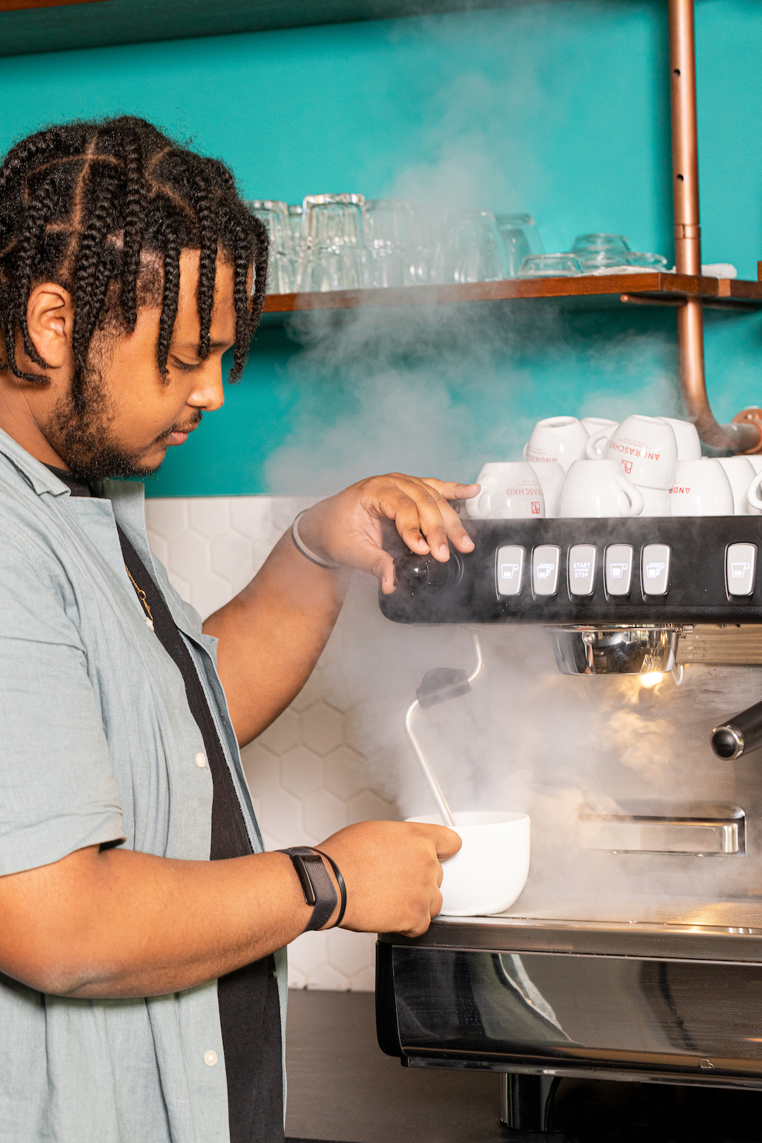 Barista preparing a fresh coffee at Coffee Inn Hostel Berlin